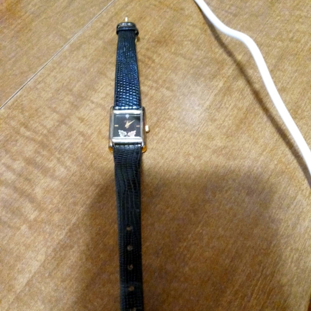 Women's Black hills Gold watch with 12 karat gold leaves and diamond